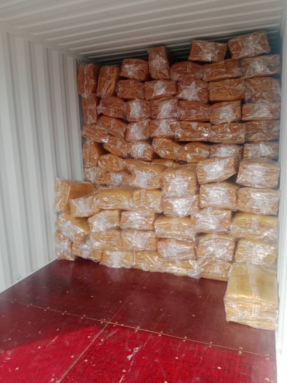 Grade stamps and export markings on rubber bale